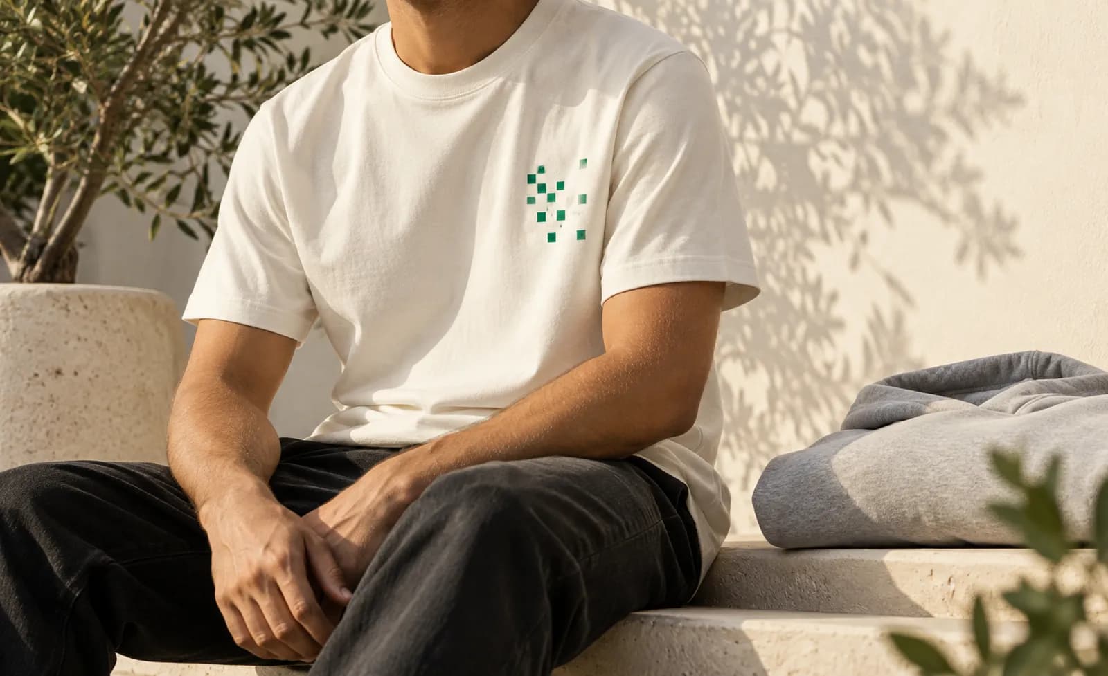 Shirt with an abstract QR pattern and folded hoodie as an example use case